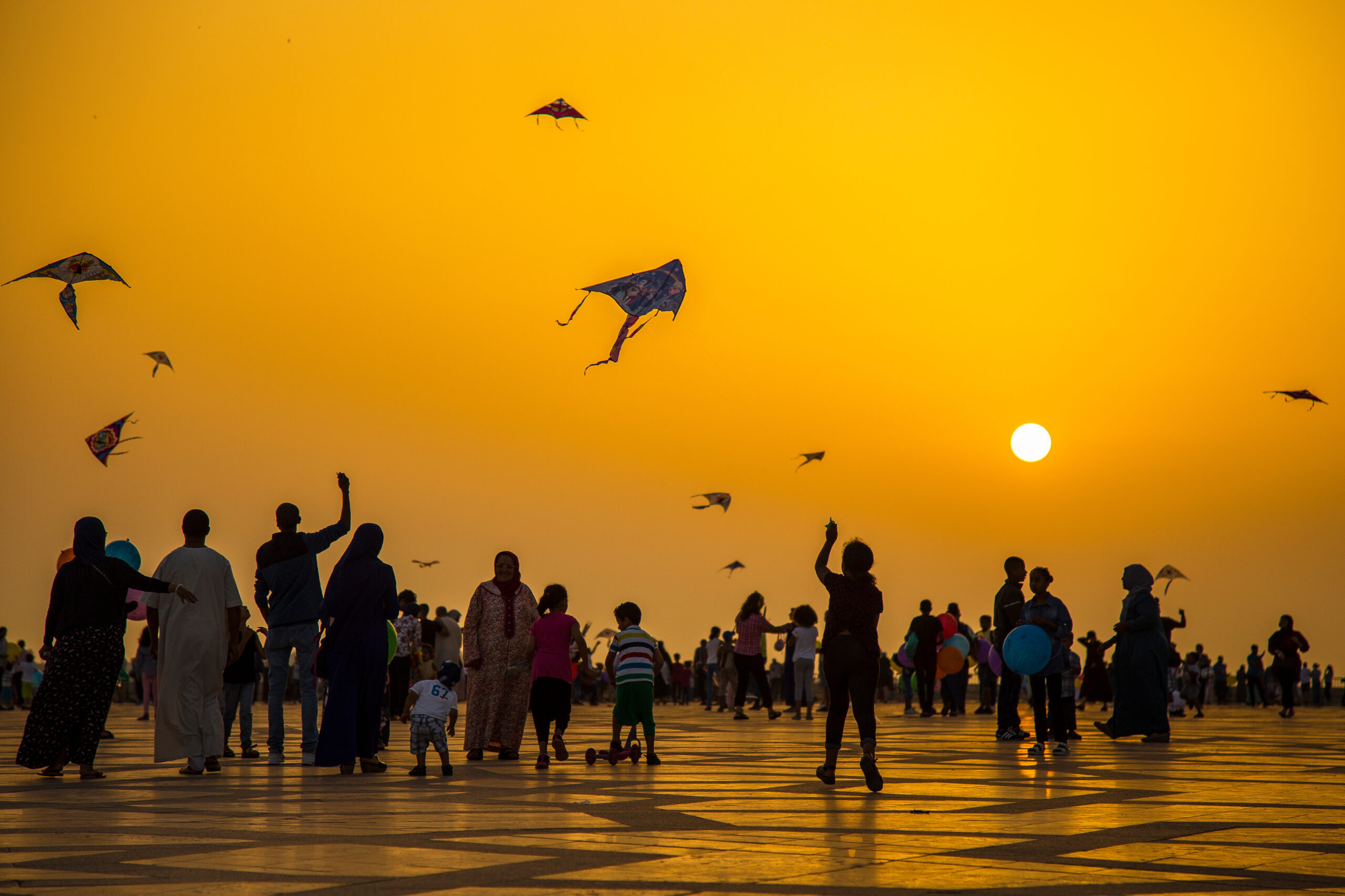 Playing with kites in Hassan II Mosque of Casablanca. Morocco